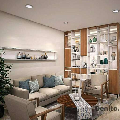 a living room with a couch, chair, and shelves.