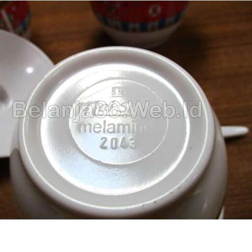 a white cup with a lid on a table.