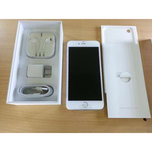 an apple iphone and a white case on a table.