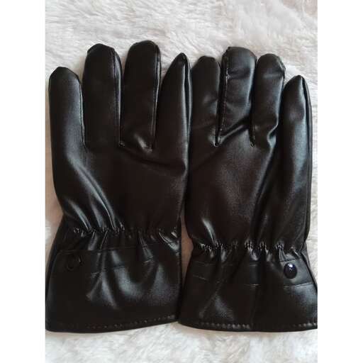a pair of black leather gloves with a white patch.