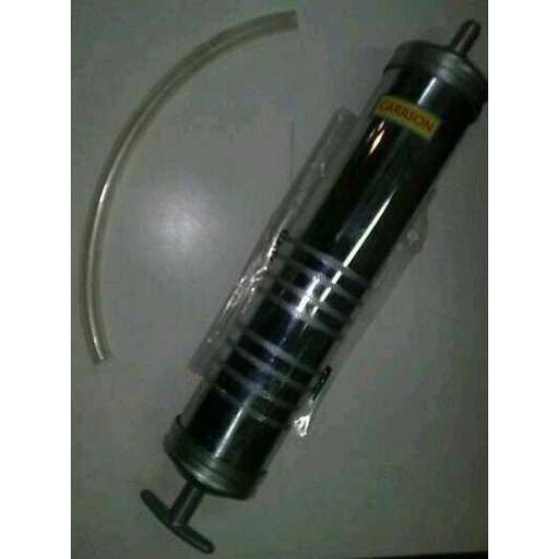 a metal object with a metal handle on a table.