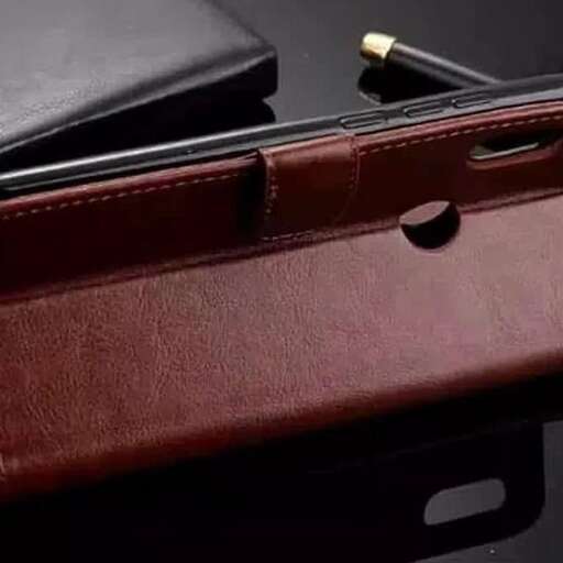 the case is made of leather and has a black leather lining.