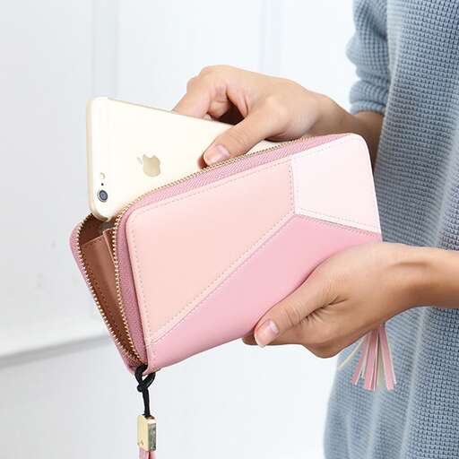 a woman holding a pink purse and a pink purse.