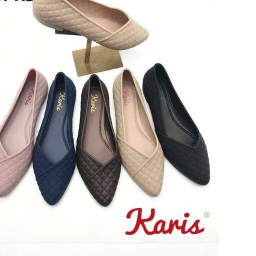 a pair of shoes with a wooden clip.