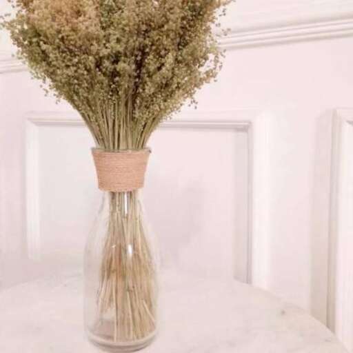 a vase filled with flowers on top of a table.