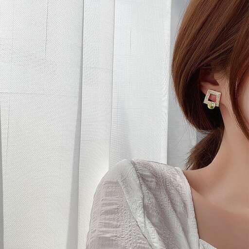 earrings with a flower in the ear