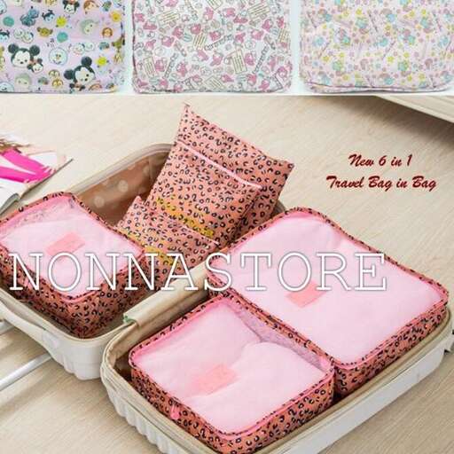 a box with a pink pillow and a pink pillow.
