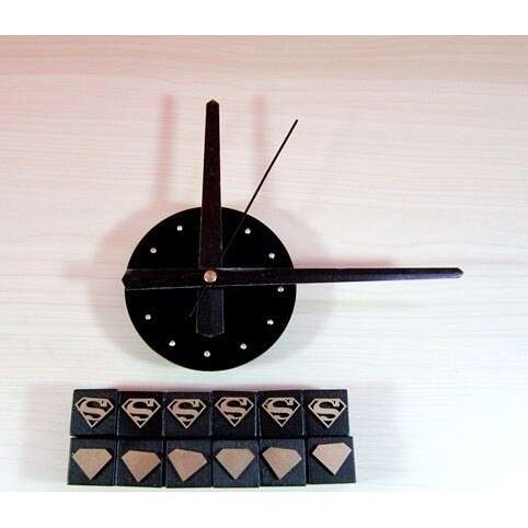 a clock with a small box and a small box of blocks.