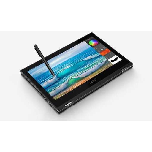 a tablet with a pen on top of it.