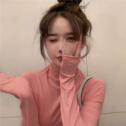 a girl with her hand over her mouth