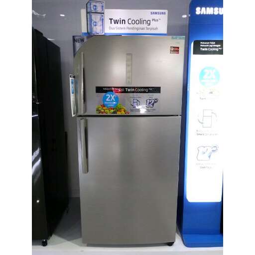 a stainless steel refrigerator sitting on a display.