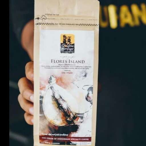 a bag of coffee with a picture of a woman holding a bag of bread.