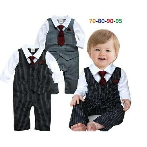 a baby boy wearing a suit and tie.