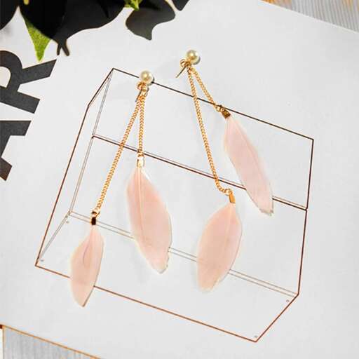 a pair of earrings with a gold frame.