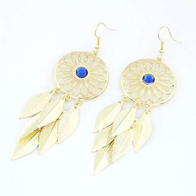 gold earrings with a blue sapphire and a blue sapphire.