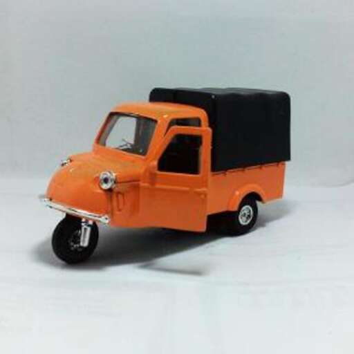 a small orange car with a black roof on top.