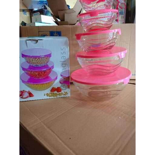 a table topped with bowls and a card.