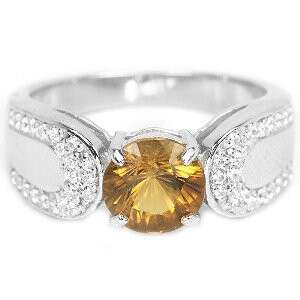 a yellow diamond ring with a yellow sapphire and diamonds.