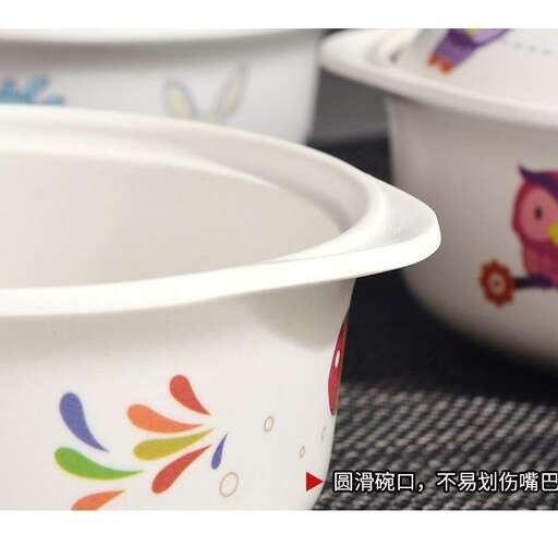 a white bowl with a colorful design on it.