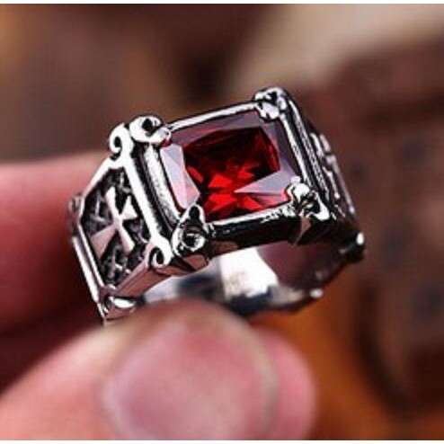 a ring with a red stone
