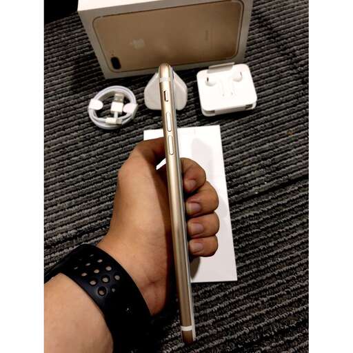 a person holding a tool on a table.