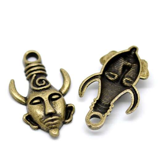 a pair of gold and silver earrings