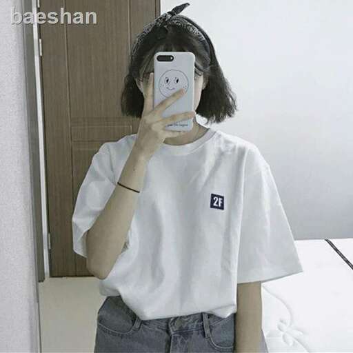 a girl is taking a picture of herself in a mirror.