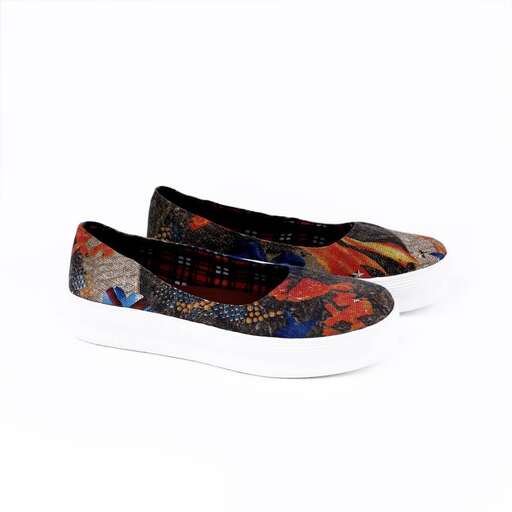 a pair of shoes with a floral print.