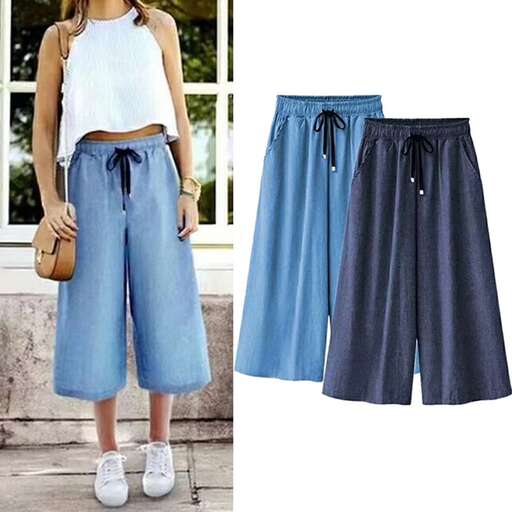 a pair of blue jeans with a white top and a black bow.