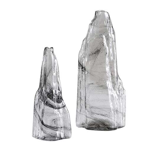 a glass bottle with a geometric design.