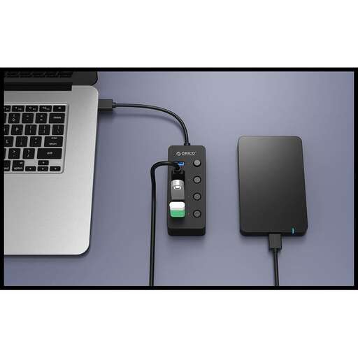 a laptop and a charger connected to a laptop.