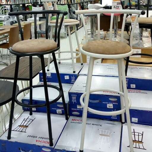 a room filled with lots of different chairs.