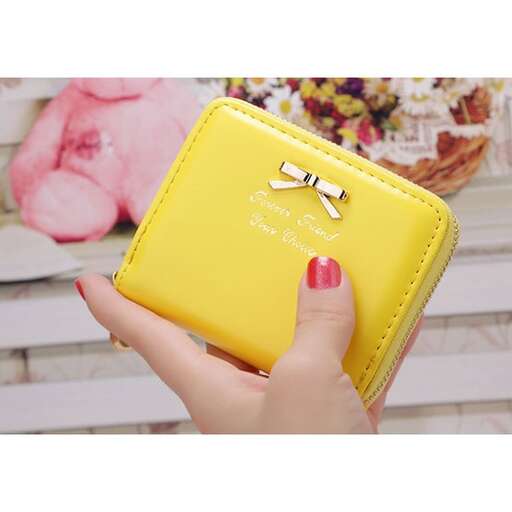 a yellow wallet with a zipper in the middle.