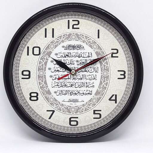 a clock with a black face and red hands.