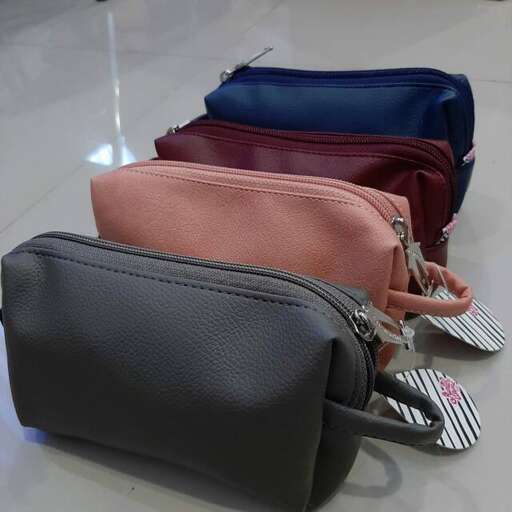 a group of different colored bags on the floor.