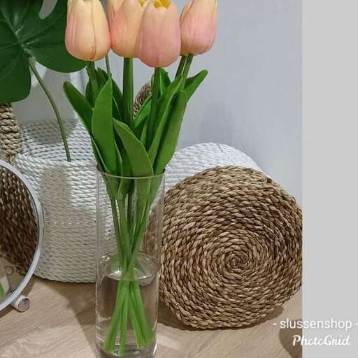 a vase of flowers sitting on a table.