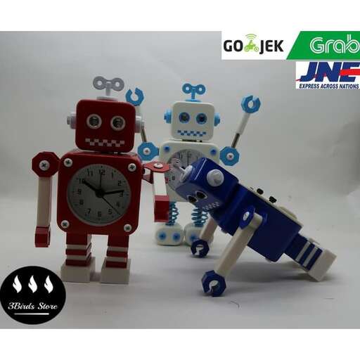 a couple of robots that are next to a clock