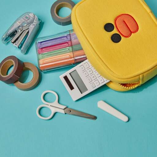 a yellow bag with scissors and a pair of scissors.