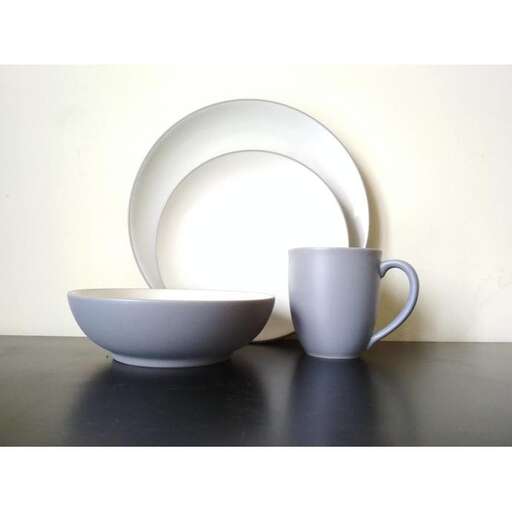 a plate and a cup on a table.