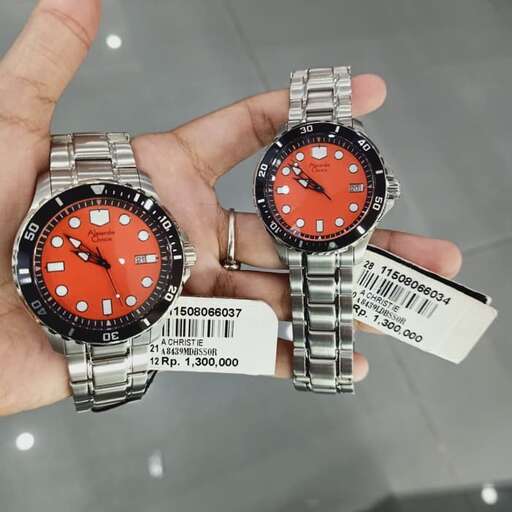 a person holds a pair of watches.