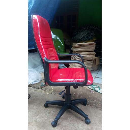 a red office chair with a black seat.