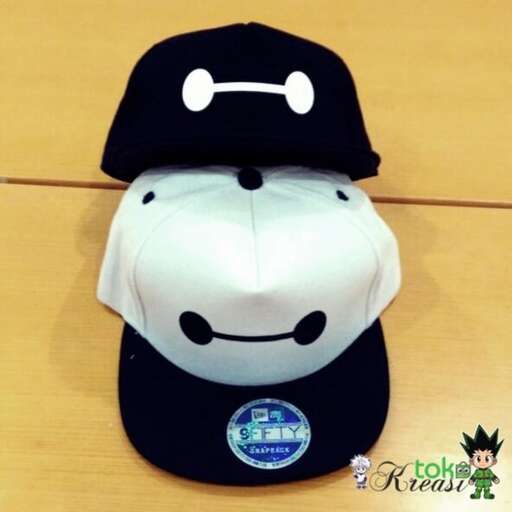 a black and white baseball cap with a white face on it.