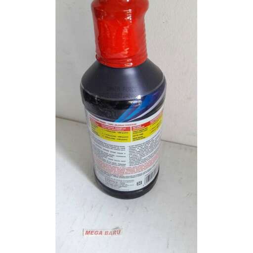 the top of the bottle is covered in a red cap.