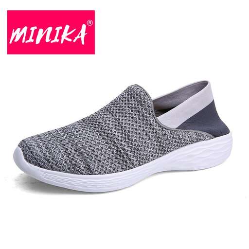 women's casual slip - on sneaker with a white sole and a black sole