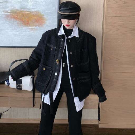 a mannequin wearing a black jacket and pants.