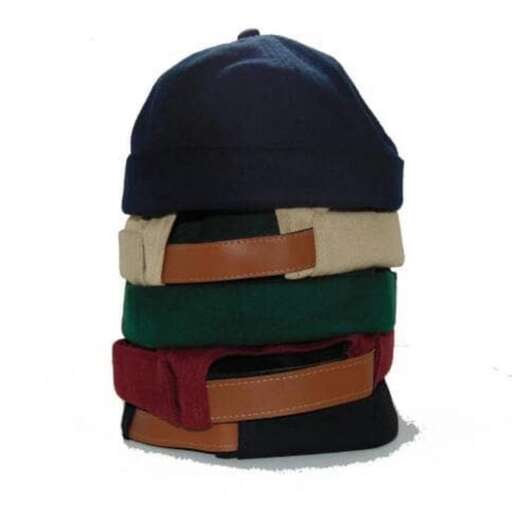 a hat with a brown strap on top of it.