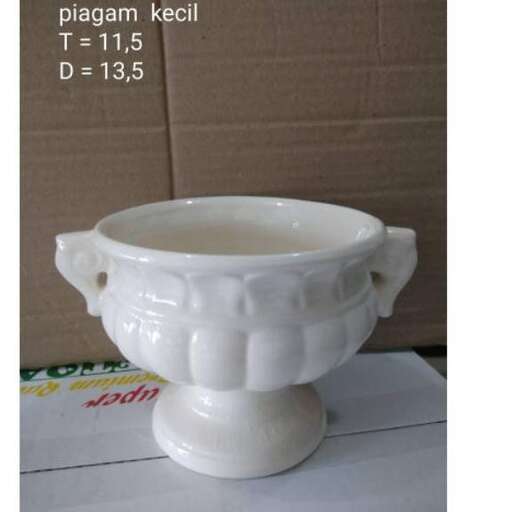 a white bowl with a lid and a small bowl inside.
