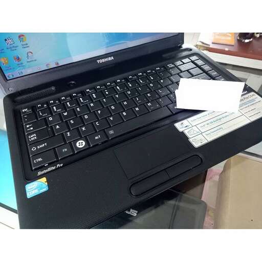 a laptop computer sitting on top of a desk.