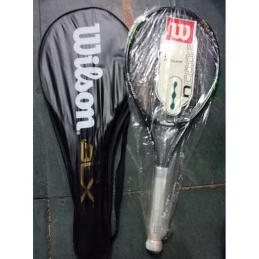a tennis racket with a tennis racket in a plastic bag.