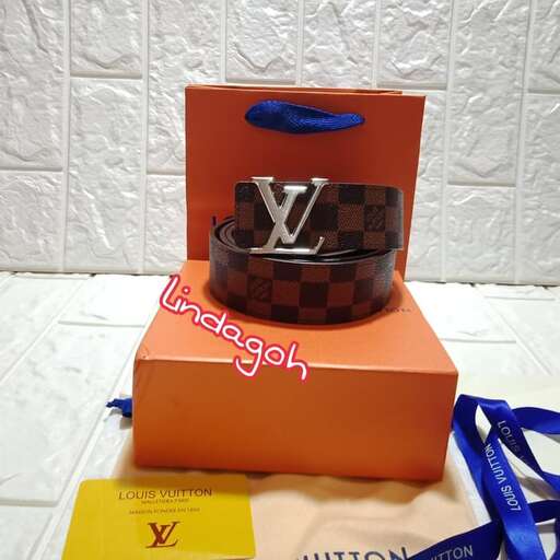 a cake with a bag on top of it.